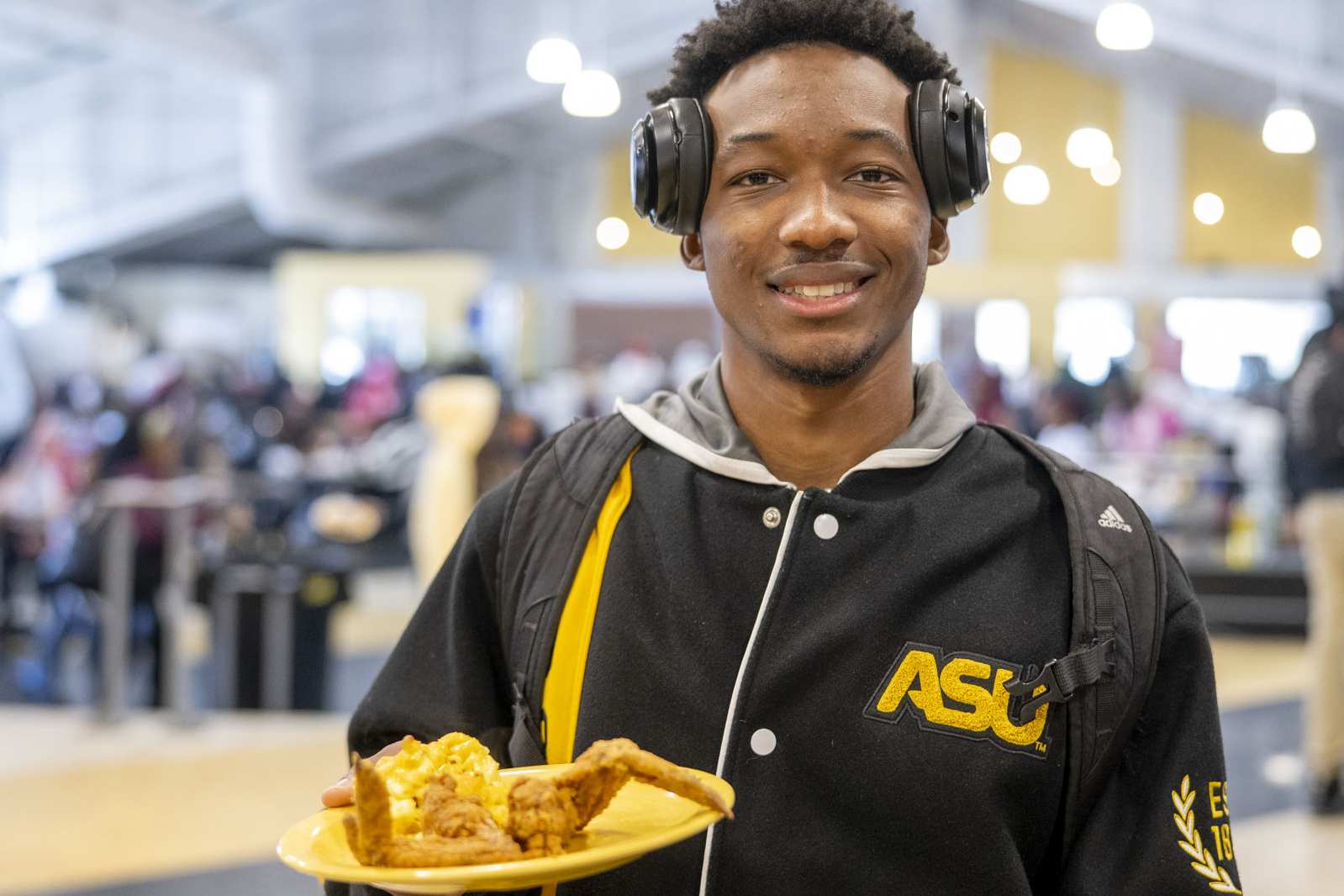 ASU Student eating chicken and mac n' cheese