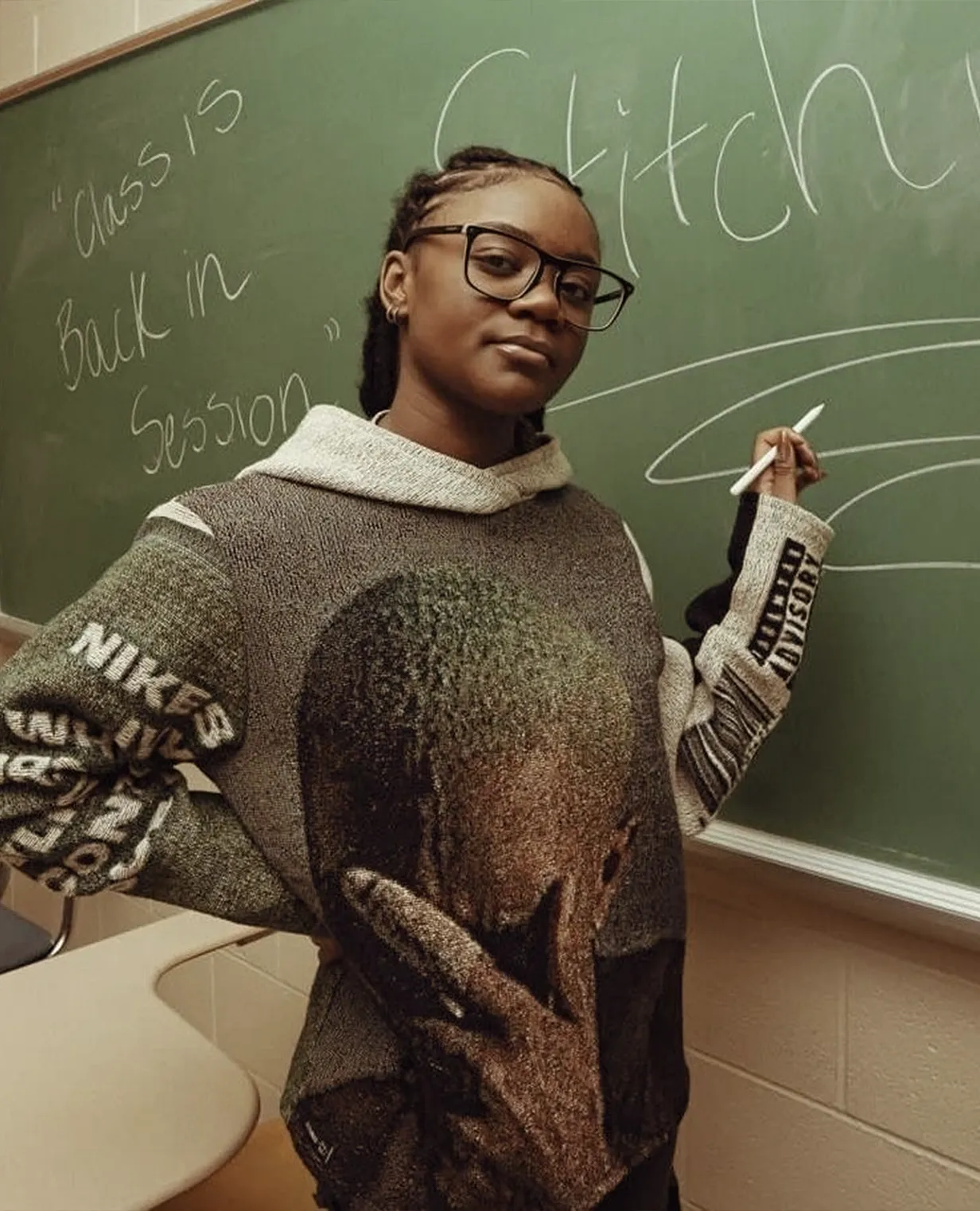 Engineering student standing in front of a chalkboard