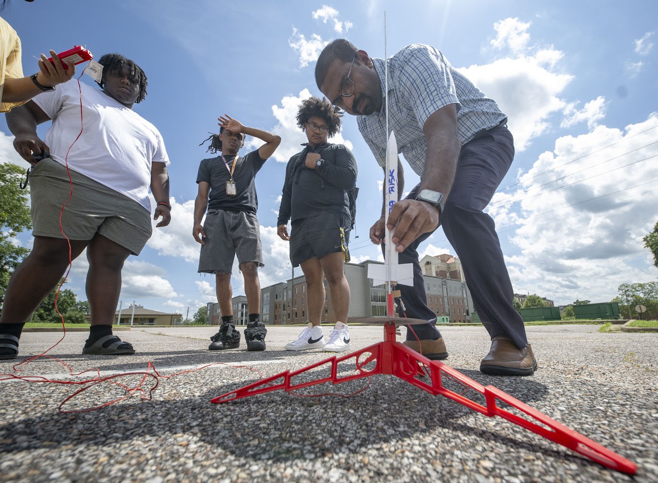 Students with model rockets